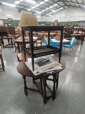 Lot 133 - A vintage oval oak gateleg table on turned...