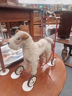 Lot 138 - A vintage push along plush fox terrier toy...