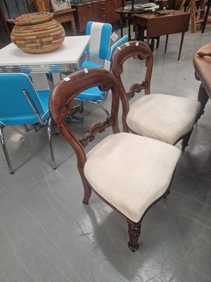 Lot 141 - Three Victorian mahogany balloon back dining...