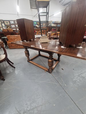 Lot 143 - A vintage oak draw leaf refectory table...