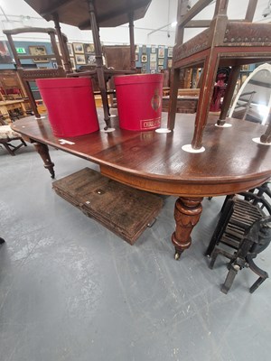 Lot 152 - A Victorian oak wind-out dining table, the...
