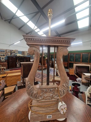 Lot 154 - A carved lime wood lyre form table lamp base...