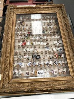 Lot 693 - A collection of thimbles contained in a...