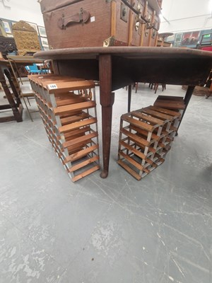 Lot 169 - Three wood and metal wine racks, one for...