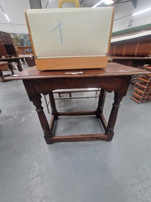 Lot 170 - An 18th century oak side table, the shaped...