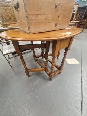 Lot 174 - A vintage golden oak gateleg table in...