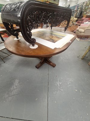 Lot 176 - A vintage oak extending pedestal dining table,...