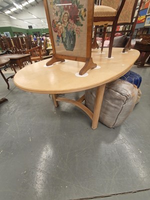 Lot 180 - A modern extending oval dining table, the ends...