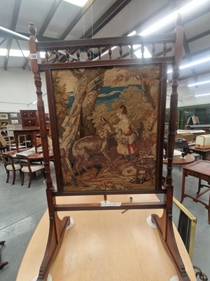 Lot 182 - A late Victorian mahogany fire screen inset...