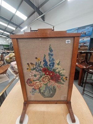 Lot 183 - An early 20th century oak fire screen set with...