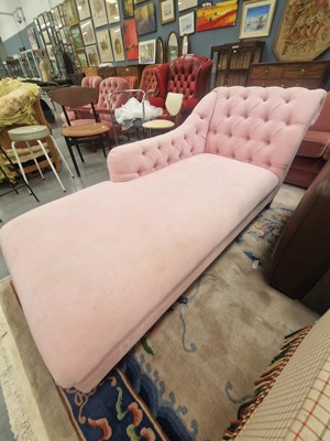 Lot 194 - A vintage pink upholstered button back chaise...