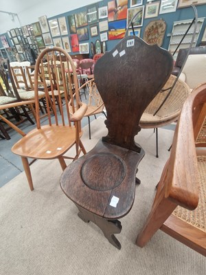Lot 197 - An antique oak Sgabello form hall chair