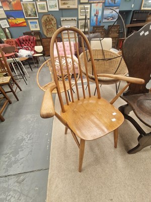 Lot 198 - A mid century oak spindle back arm chair in...