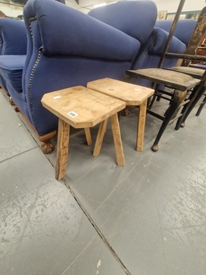 Lot 206 - Two vintage oak three legged cutler's type stools