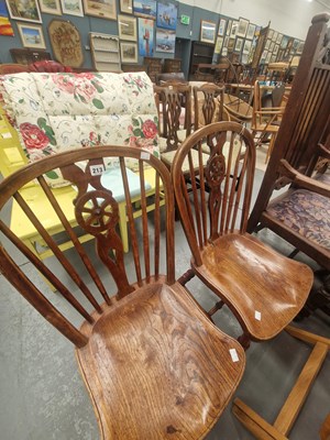 Lot 213 - A pair of antique elm seat wheelback chairs on...