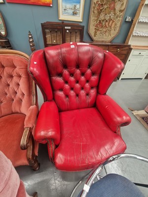 Lot 222 - A vintage 1980s leather button back wing chair...