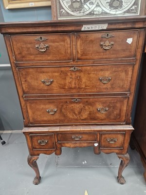 Lot 227 - A walnut chest on stand, the top with two...