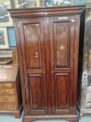 Lot 230 - A modern hardwood panel door double wardrobe...