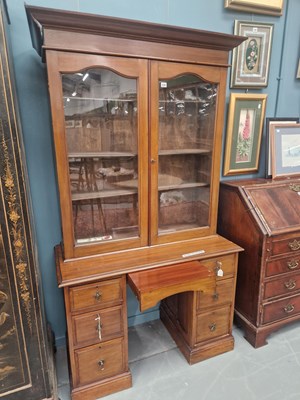 Lot 232 - A Victorian mahogany library bookcase, the two...