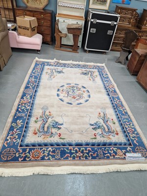 Lot 1400 - A Chinese dragon decorated carpet, 284 × 209cm