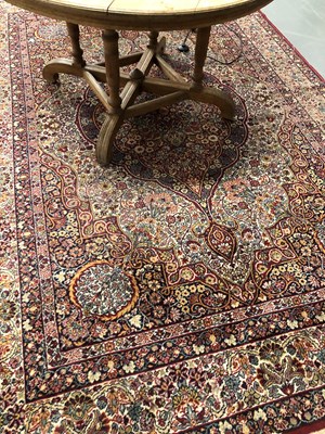 Lot 1405 - A machine made rug of Persian design 295 × 200cm