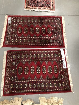 Lot 1412 - Two similar small oriental rugs of Bokhara...