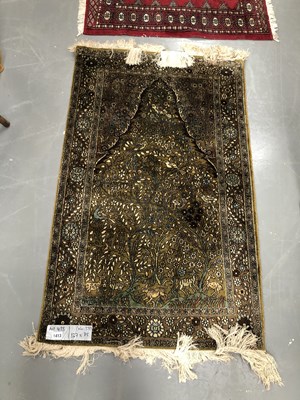 Lot 1413 - A finely woven oriental rug with a tree of...