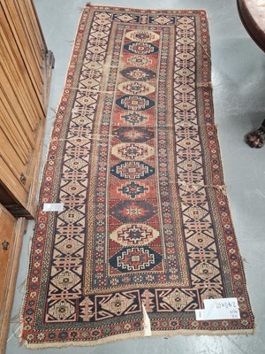 Lot 1434 - An antique Caucasian runner 245 × 111cm