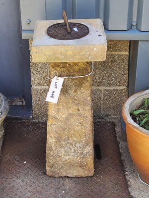 Lot 448 - A concrete sundial with a plinth