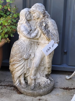 Lot 450 - A stone statue of a male and female figures...