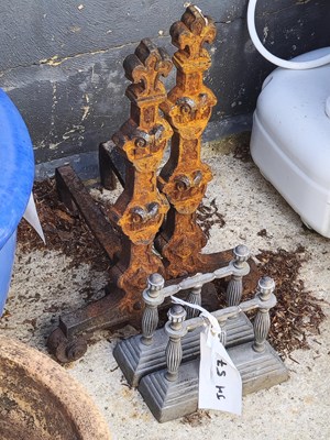 Lot 457 - Two sets of different-sized fire dogs
