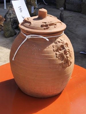 Lot 461 - A charming terracotta pot with a lid decorated...