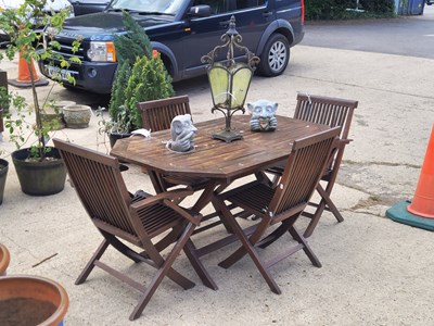 Lot 464 - A teak (stained mahogany colour) garden dining...