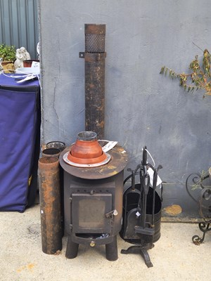 Lot 471 - A metal stove, together with a coal bucket and...