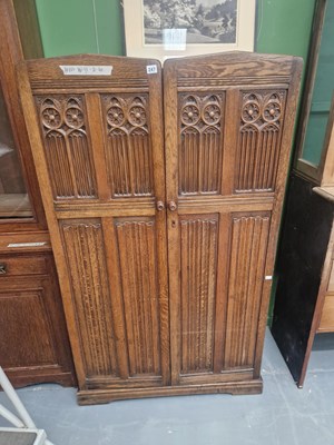 Lot 247 - A 20th century oak linenfold two door wardrobe...