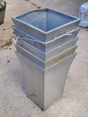 Lot 481 - A set of five matching metal garden pots