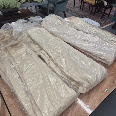 Lot 910 - Four large cream interlined curtains, each...