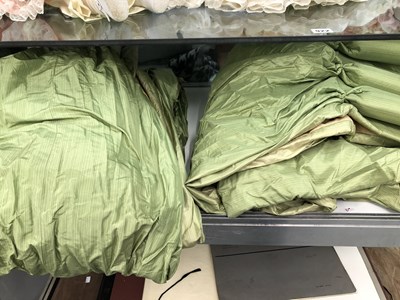 Lot 923 - A large pair of green satin interlined curtains