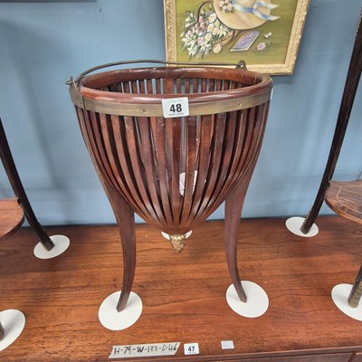 Lot 48 - An Edwardian brass-mounted basket form jardiniere