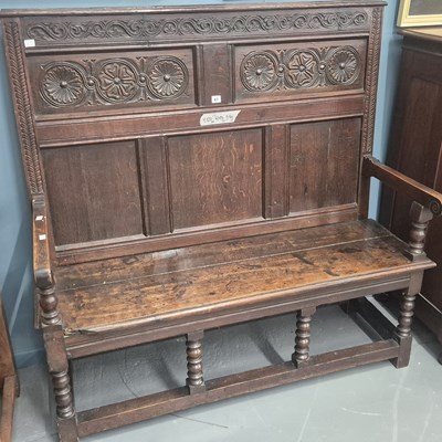 Lot 67 - A 19th-century oak panel back hall settle H...