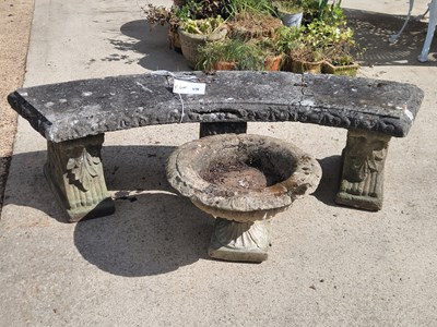 Lot 498 - A weathered concrete bench on three pedestals...