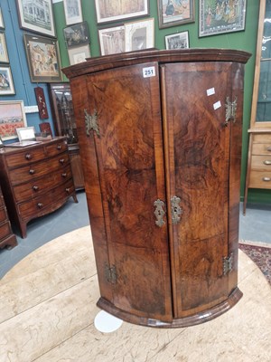 Lot 251 - A small 19th century walnut bow front corner...