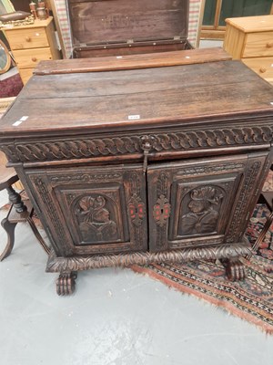 Lot 270 - A 19th century carved oak side cabinet, the...