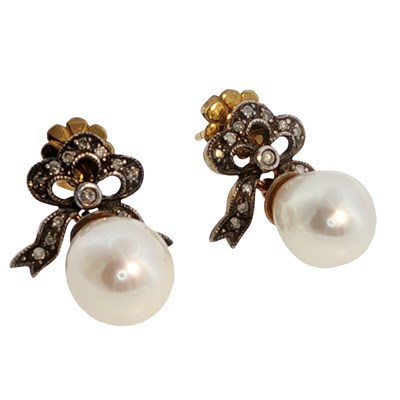 Lot 1102 - A pair of Edwardian diamond-set bow earrings...