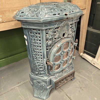Lot 293 - A vintage French enamel room heater stove