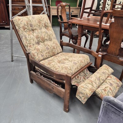 Lot 321 - A vintage retro teak-framed reclining armchair.