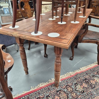 Lot 324 - A hardwood kitchen/dining table on turned legs...