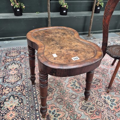 Lot 328 - A walnut topped shaped seat stool