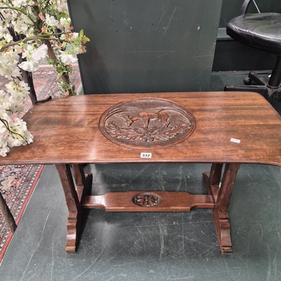 Lot 332 - An interesting carved hardwood coffee table H...