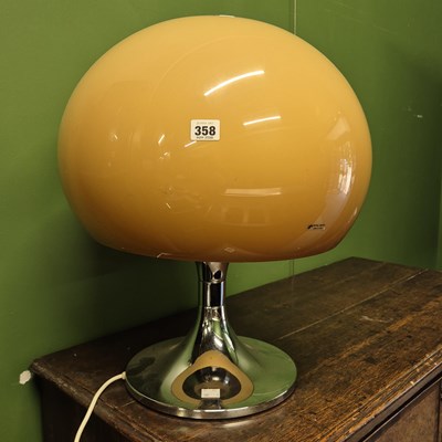 Lot 358 - A mid-century retro table lamp by Harvey Guzzini